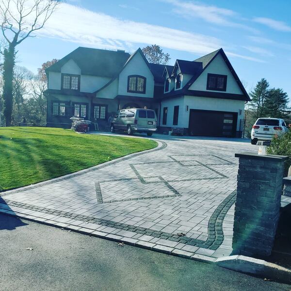 Wide paver driveway with fan pattern at entrance