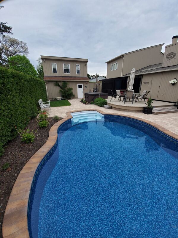 Rectangular pool with slip-resistant paver decking